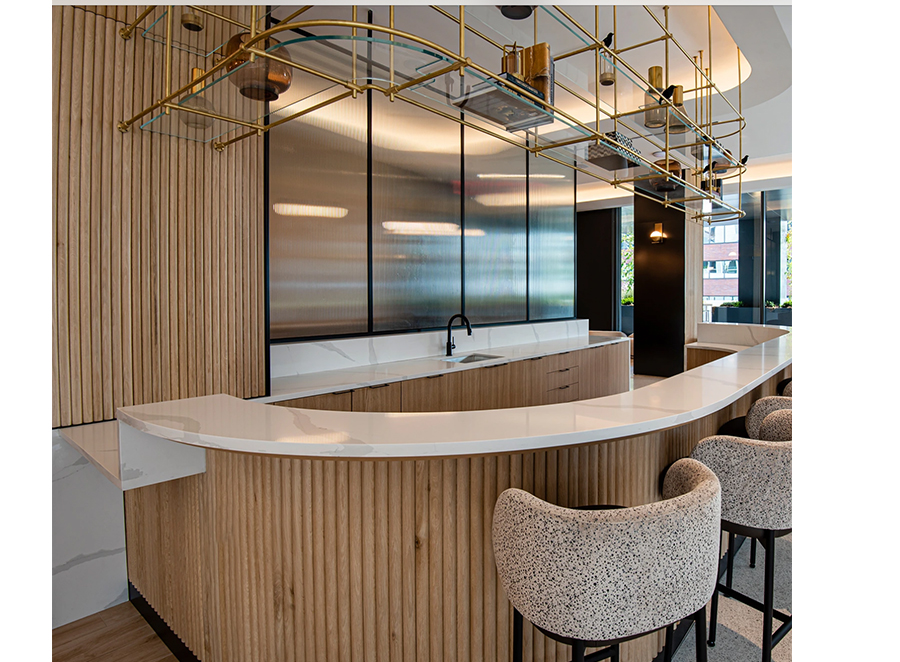 Custom tambour paneling with iron shelves above and marble top.