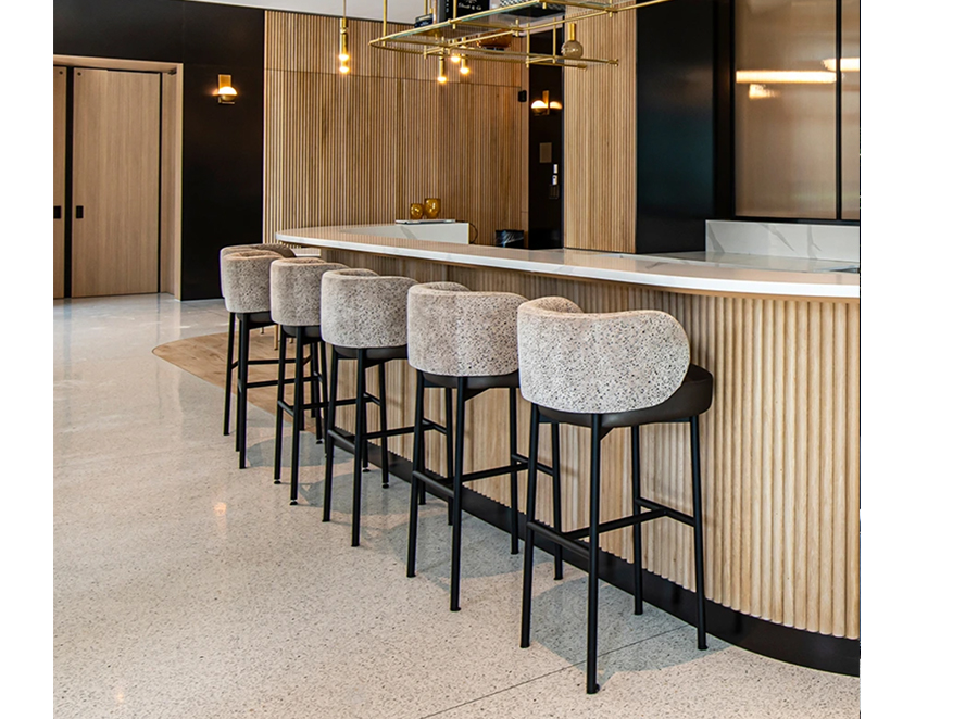 Custom tambour paneling with iron shelves above and marble top.
